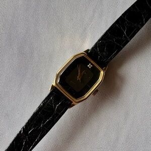 Vintage women’s Elegant Black and Gold Watch